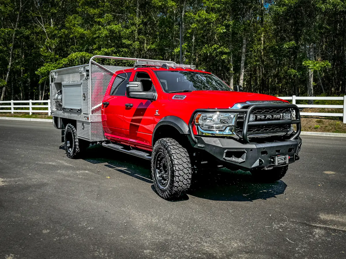 Head-on front exterior view with grille guard and heavy-duty bumper.